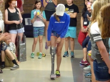 student proving prosthesis is function in competition